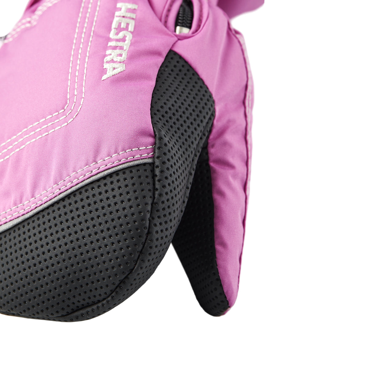 Close-up of a pink glove with black textured palm area on a light gray background