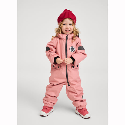 Child wearing a pink snowsuit with black accents on a white background