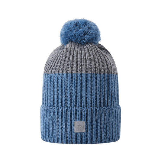 Blue knit beanie with pom-pom on a white background
