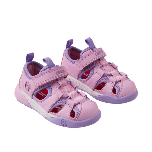 pair of pink toddler sandals on a white background