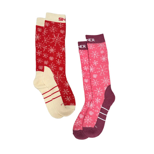 Two pairs of kids ski socks with snowflake patterns on a white background