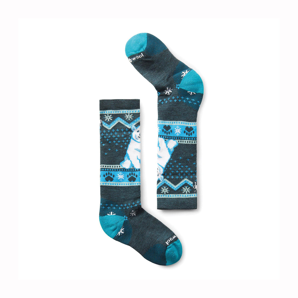Pair of merino wool kids ski socks with polar bear design on a white background