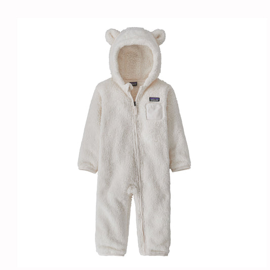 White baby onesie with bear ears and nose on a white background