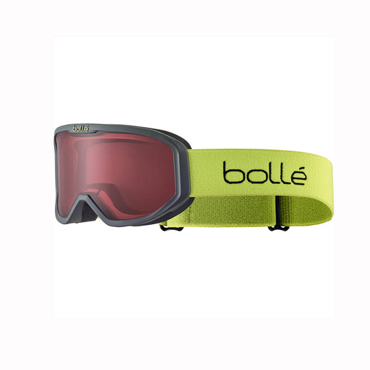 Ski goggles fot toddlers with red lens and green strap on a white background, featuring the Bolle brand.