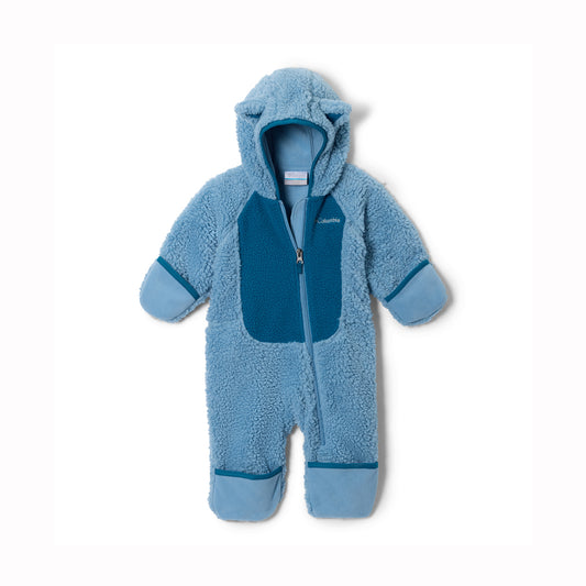 A baby's fleece footed one-piece sleeper in light blue with darker blue contrast panels on the chest, hood lining, cuffs, and ankles, shown against a plain white background.