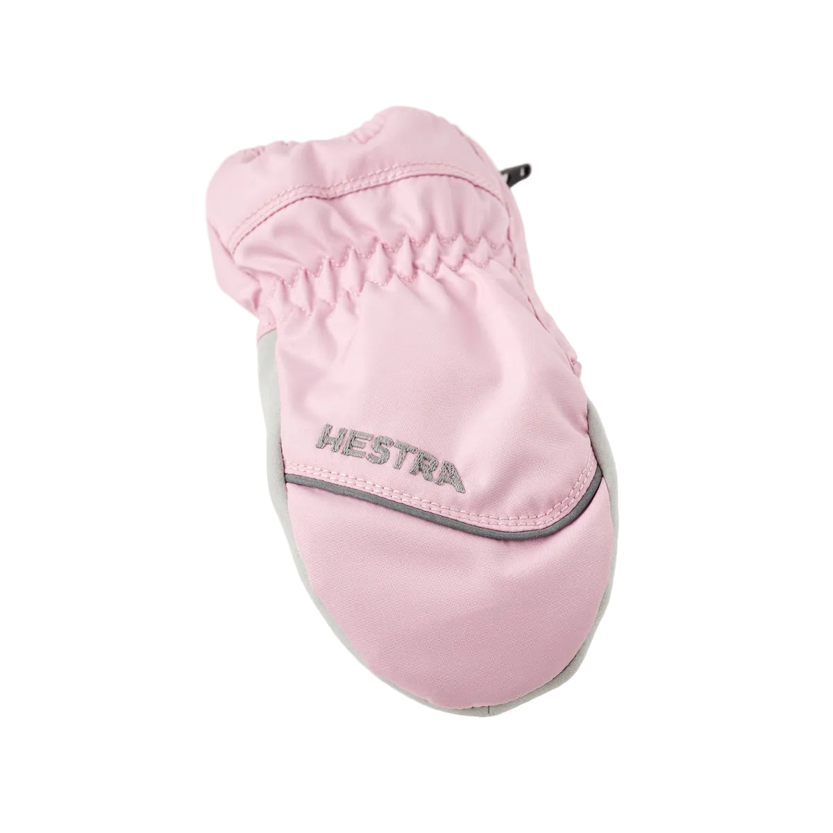 A light pink winter glove with 'HESTRA' printed in gray on the front, set against a clean white background.