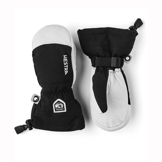 Pair of black and white Hestra kids mittens on a white background