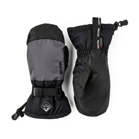 Pair of black and gray Hestra kids mittens on a white background