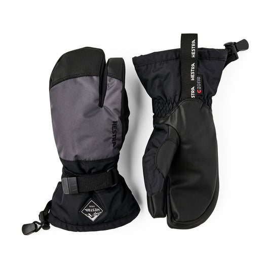 Pair of black and gray hestra kids mittens with visible branding on a white background