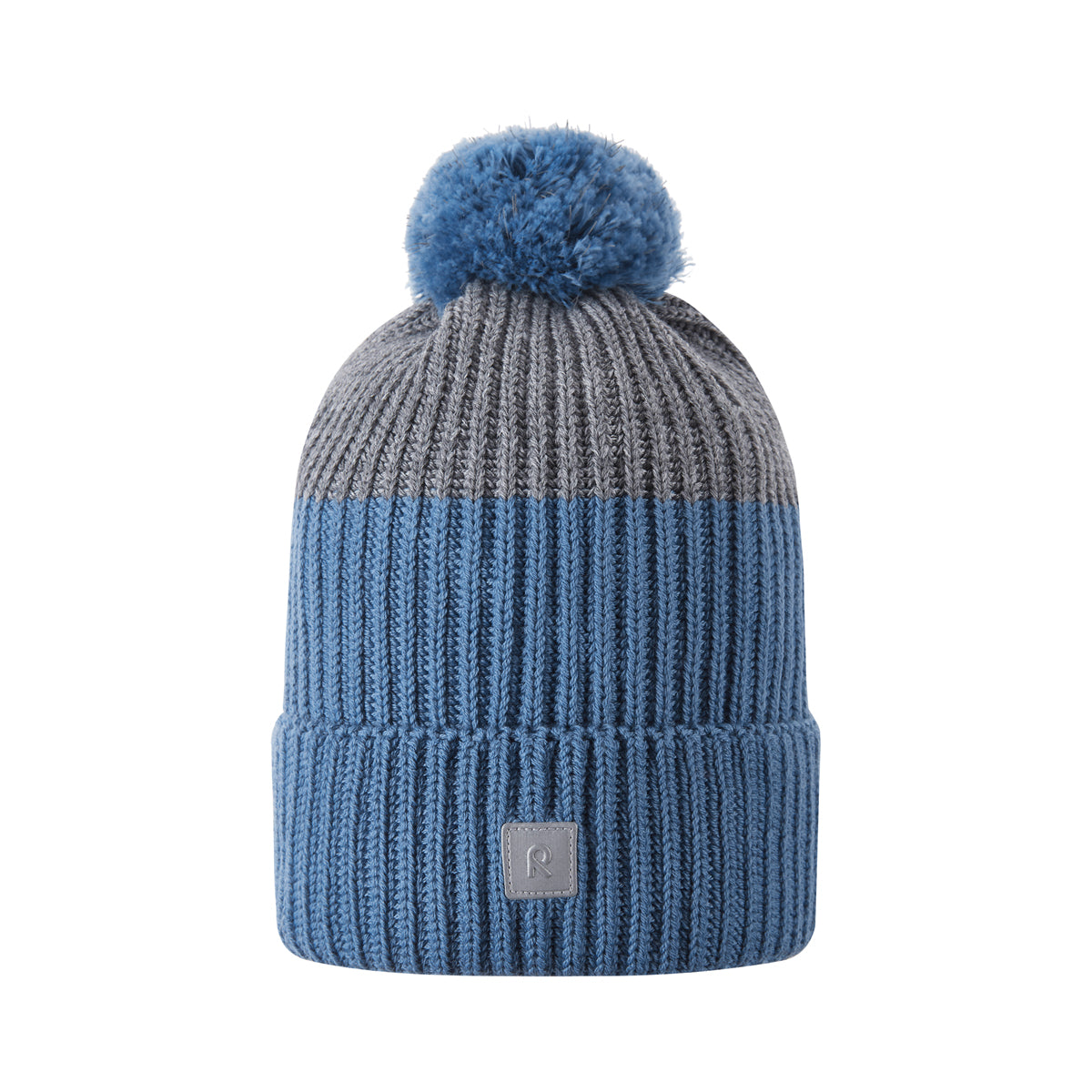Blue knit beanie with pom-pom on a white background