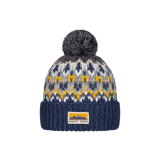 A knit pom-pom beanie hat featuring a navy blue cuff, a gray and white patterned upper section with yellow accents, and a gray pom-pom on top. A rectangular Barts Tuscany brand patch is visible on the cuff.