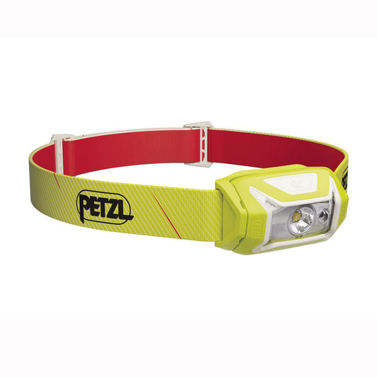 Yellow headlamp with red strap on a white background