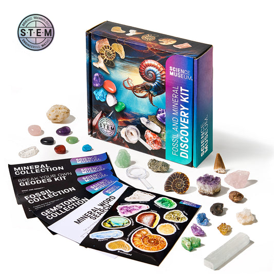 Science Museum fossil and mineral discovery kit with various specimens and educational materials on a white background.