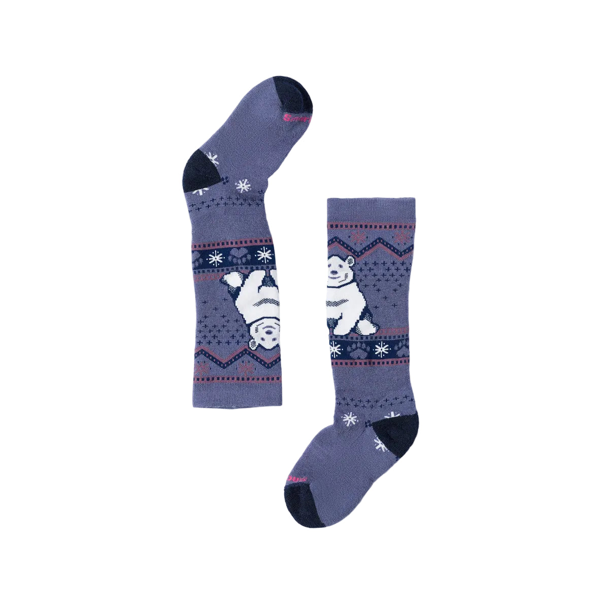 A pair of Kids ski socks in a dusty purple-blue color, featuring a white polar bear and snowflake pattern on a navy blue band, with dark navy heels, toes, and cuffs, displayed on a light gray background.