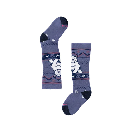 A pair of Kids ski socks in a dusty purple-blue color, featuring a white polar bear and snowflake pattern on a navy blue band, with dark navy heels, toes, and cuffs, displayed on a light gray background.