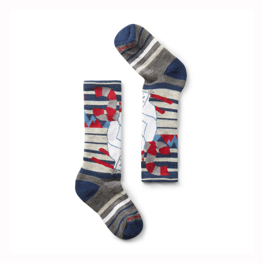 Two pairs of children's ski socks with a cartoon yeti design on a white background
