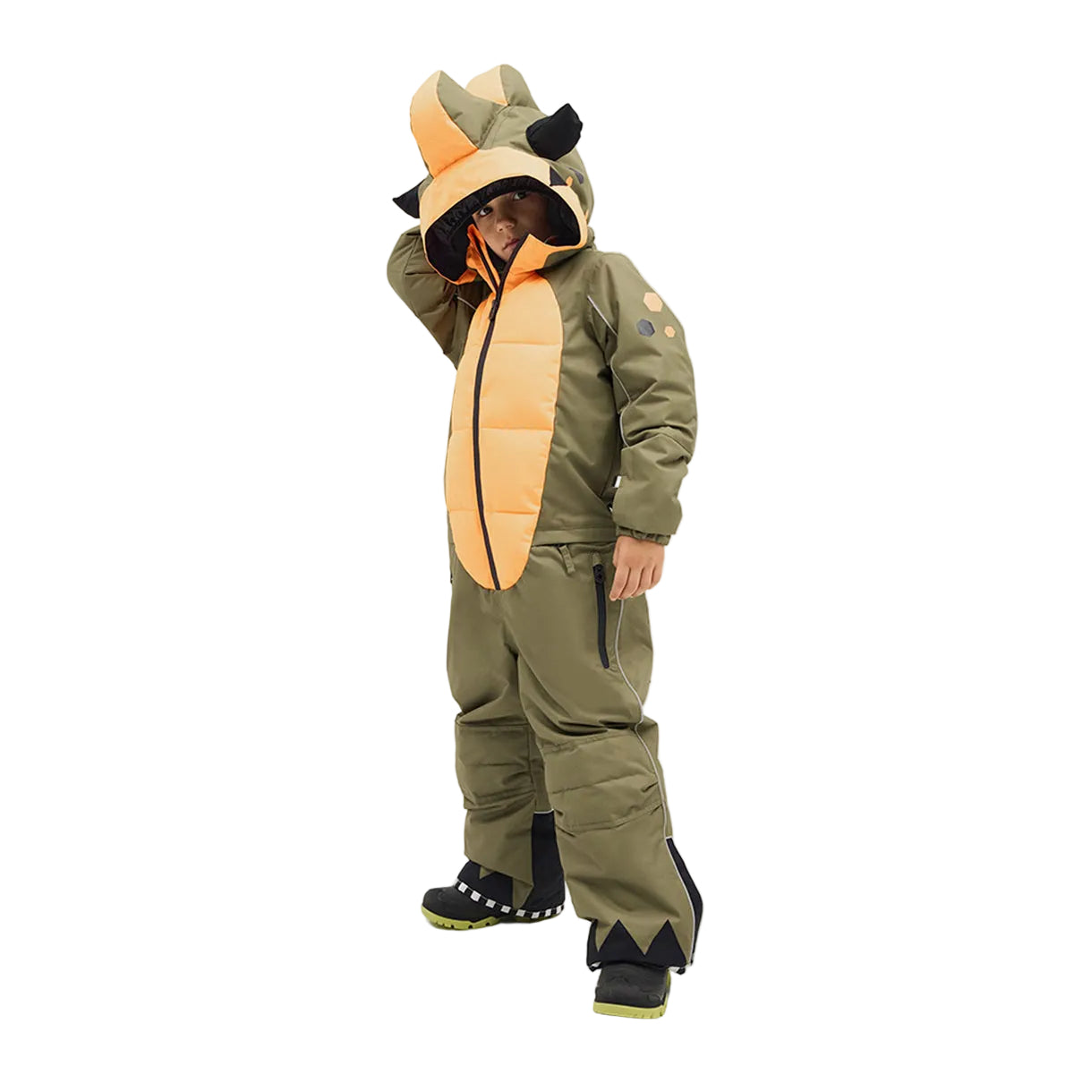 Child wearing a green dinosaur ski suit onesie on a white background