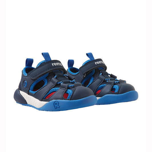 Pair of navy toddler sandals on a white back ground