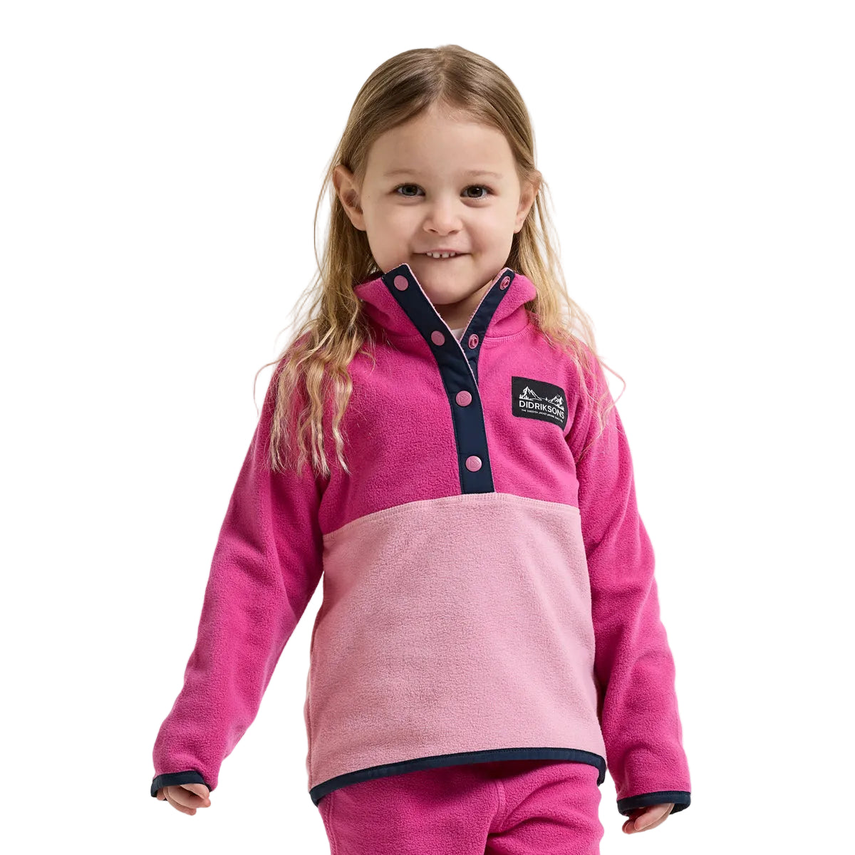 Child wearing a pink and purple fleece with a visible brand logo on a white background